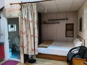 Postel nebo postele na pokoji v ubytování Checheng Backpackers Hostel