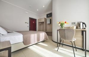 A bed or beds in a room at Albergo Silvio