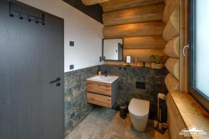 Ένα μπάνιο στο Haus 8 Auszeit im Harz - Haus 8 Blockhaus oben +26 φωτογραφίες