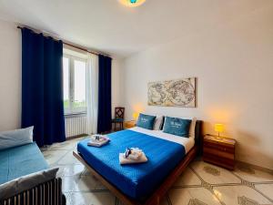 Posteľ alebo postele v izbe v ubytovaní Villa Falconieri Sorrento Suite