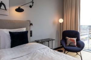 Ένα ή περισσότερα κρεβάτια σε δωμάτιο στο Scandic Grand Central Helsinki