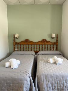 Postel nebo postele na pokoji v ubytování Hostal Quinto Pino