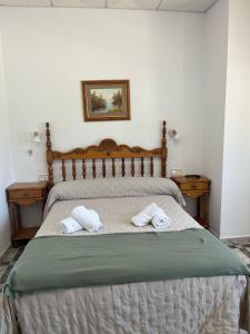 Postel nebo postele na pokoji v ubytování Hostal Quinto Pino