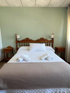 Postel nebo postele na pokoji v ubytování Hostal Quinto Pino