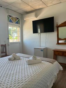 Postel nebo postele na pokoji v ubytování Hostal Quinto Pino