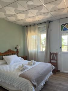 Postel nebo postele na pokoji v ubytování Hostal Quinto Pino