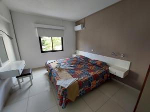 a bedroom with a bed and a sink in it at Hilltop Gardens Hotel Apartments in Paphos City +25 photos