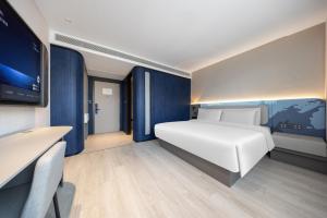 Letto o letti in una camera di Atour Light Hotel Nanjing Xinjiekou Hanzhongmen Subway Station