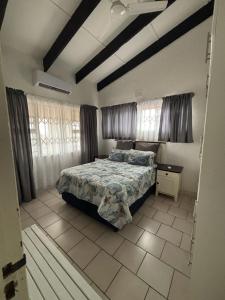 a bedroom with a bed in a room with windows at Natspat 10 in Margate +23 photos