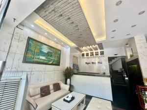 a living room with a couch and a table at Ngọc Hoa Mai Hotel in Ho Chi Minh City