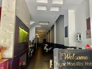 a long hallway with a waiting room with couches at Ngọc Hoa Mai Hotel in Ho Chi Minh City