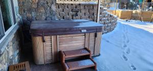 a wooden sink with a stool next to a building at Rustic Treehouse in Peyton +7 photos