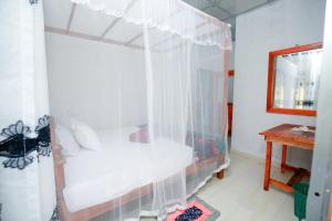 Postel nebo postele na pokoji v ubytování Sepali House Nilwella