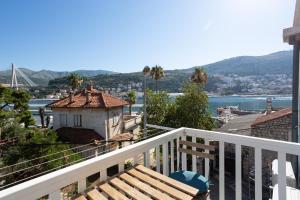 a balcony of a building with a view of the water at Orsan Residence Apartment in Dubrovnik