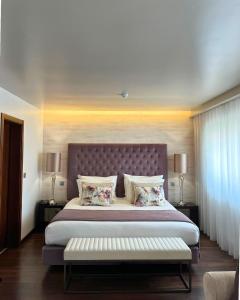 Ένα ή περισσότερα κρεβάτια σε δωμάτιο στο Belem Hotel