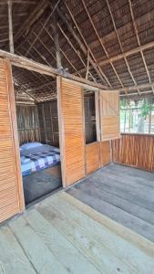 Кровать или кровати в номере Angganeti Homestay