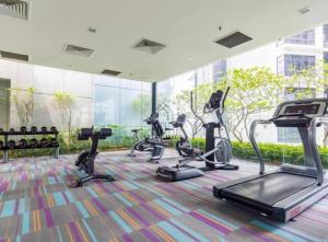 a gym with cardio equipment in a building at Summer Hotel and Condo Suites Nearby KLCC Area in Kuala Lumpur