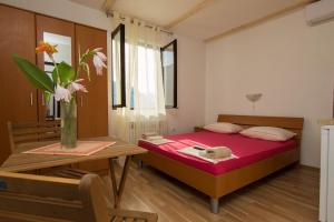 A bed or beds in a room at Seaside Studio Mare, only 15 meters from sea