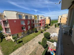 a view of an apartment complex from a balcony at Sunny day 5 in Tŭnkovo