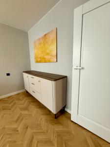 TV a/nebo společenská místnost v ubytování Naujai įrengti apartamentai Morkus Šiauliai