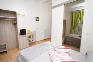 Postel nebo postele na pokoji v ubytování Al Bastione Relais Suite & Rooms
