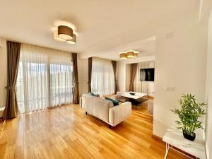 a living room with a couch and a table at Luxury Apartments Przno in Budva