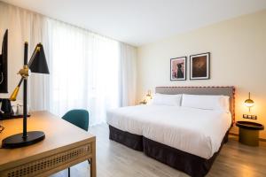 Łóżko lub łóżka w pokoju w obiekcie Hotel Barú