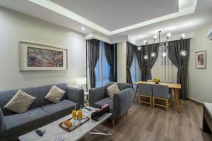 a living room with a couch and a table at Boudl Al Fayhaa in Riyadh