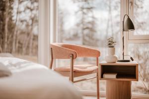 Postel nebo postele na pokoji v ubytování Jegtvolden Fjordhotell