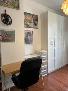 a room with a desk and a black chair at Beautiful 3-room, Porte Saint-Cloud, Paris in Paris