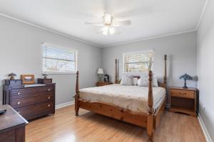 a bedroom with a bed and a ceiling fan at Country Charmer in Sevierville