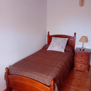 A bed or beds in a room at CASA DE LA CRUZ