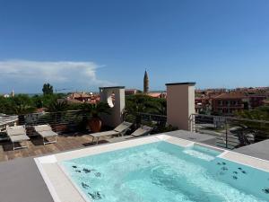 a swimming pool on the roof of a house at Eco Hotel Cleofe in Caorle