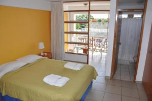 Postel nebo postele na pokoji v ubytování Hotel Bracamonte