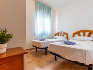Posteľ alebo postele v izbe v ubytovaní Holiday Home Zona Estival-2 by Interhome