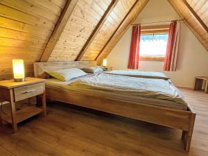 Ένα ή περισσότερα κρεβάτια σε δωμάτιο στο Holiday Home Backhäusle by Interhome