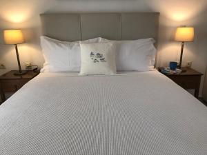 A bed or beds in a room at Aegean Blue Horizon