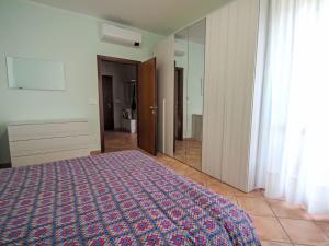 A bed or beds in a room at Apartment Euroville-9 by Interhome