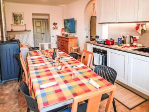 a kitchen with a table with a colorful table cloth on it at Holiday Home Castello by Interhome in Dervio