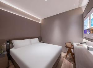 Katil atau katil-katil dalam bilik di Crystal Orange Hotel Shanghai Caohejing Yishan Road