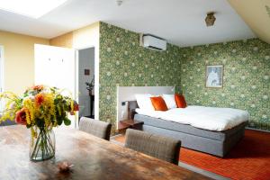Postel nebo postele na pokoji v ubytování Hotel de Wereld