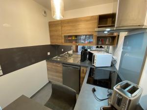 Kuchyň nebo kuchyňský kout v ubytování Appartement moderne proche centre Capbreton + 2 fotografie