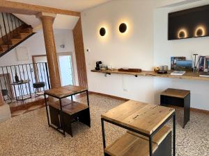 a living room with two tables and a counter at Sea Tower Torre Telemetrica Lido di Venezia in Venice-Lido