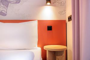 Postel nebo postele na pokoji v ubytování McDreams Hotel Wuppertal City