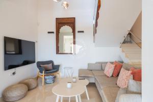 a living room with a couch and a table at CostaBlancaDreams Casa con Vista in Calpe in Empedrola