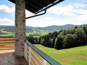 a balcony with a view of a field and mountains at Holiday Home Marianne by Interhome in Baierweg