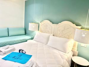 Postel nebo postele na pokoji v ubytování Hotel Astigiana & Appartamenti
