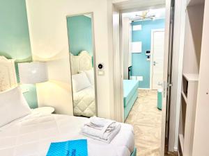 Postel nebo postele na pokoji v ubytování Hotel Astigiana & Appartamenti