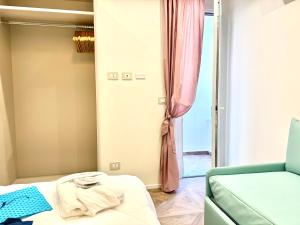 Postel nebo postele na pokoji v ubytování Hotel Astigiana & Appartamenti