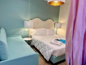 Postel nebo postele na pokoji v ubytování Hotel Astigiana & Appartamenti